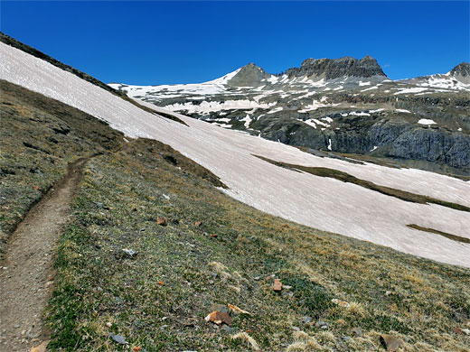 Level path, approaching a sloping snowfield