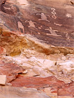 Petroglyphs above banded rock